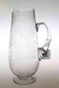 A 19th Century engraved glass water jug, of slender ovoid form,