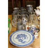 Tankards, blue and white and other plates, glass pieces, figure,