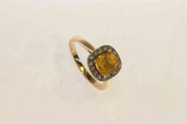 18 carat gold, cushion cut yellow sapphire and round brilliant diamond halo cluster ring,