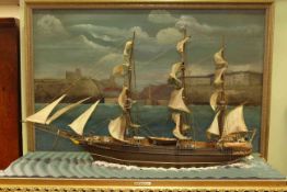 Model of 19th Century sailing ship entitled Last Adventure with a back drop oil painting of Whitby