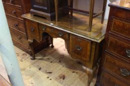 Early 20th Century walnut three drawer dressing table on cabriole legs, with quarter veneered top,