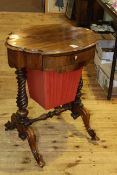 Victorian rosewood oval shaped top sewing table raised on twist pillars
