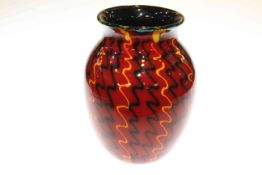 Poole Pottery vase with geometric design on red ground