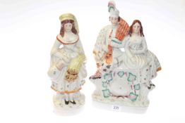 Two Victorian Staffordshire figures including a clock group, 36.