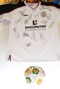 Signed Manchester United football and signed Darlington shirt