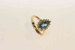 14 carat gold, pear shaped blue topaz and round brilliant diamond cluster ring,