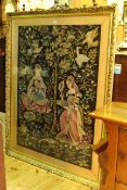 Large gilt framed tapestry depicting two ladies in woodland with birds, 147.