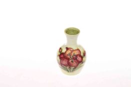 Small Moorcroft vase decorated with freesia on ivory ground,