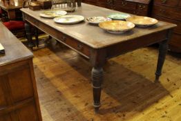 Large Victorian oak four drawer library table on turned legs,