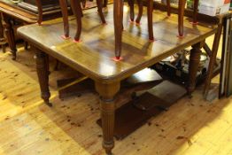 Late 19th Century/early 20th Century mahogany extending dining table and two leaves on turned