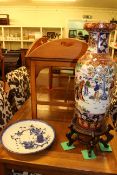 Oriental pottery vase on stand and Oriental blue and white charger