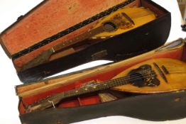 Two cased mandolins