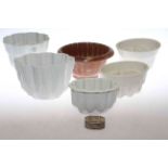 Six jelly moulds and silver napkin ring