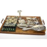 Collection of silver including brush, mirror, cased teaspoons, napkin rings, bud vase,