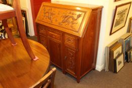 Oriental carved hardwood bureau and inset chair