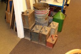 Vintage petrol and oil cans, garden tools,