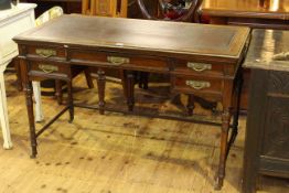 Howard & Sons, Berners St, late 19th Century rosewood five drawer writing desk on turned legs,