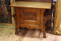 Dutch oak side cabinet with carved panel door and open side compartments,