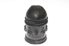 Lidded lead pot embossed with face masks