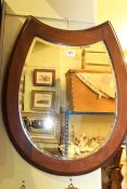 Mahogany horseshoe framed bevelled wall mirror