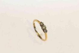 18 carat gold and three stone diamond ring,