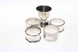 Silver egg cup, Sheffield 1944; and four silver napkin rings (5) 4.
