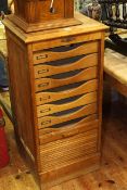 Early 20th Century oak slim tambour front filing cabinet,