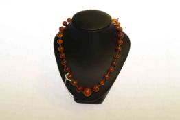 Amber coloured bead necklace, 42.