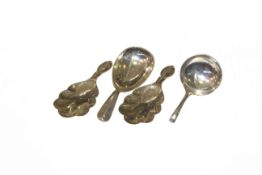 Pair of silver caddy spoons, Israel Freeman & Son Ltd, London 1931; another by the same,