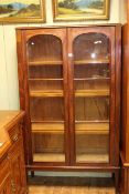 Victorian mahogany arched glazed panel door bookcase with three adjustable shelves, 173.