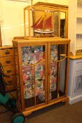 Oak two door china cabinet and cased model yacht