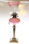 Brass column oil lamp with pink glass reservoir and etched shade