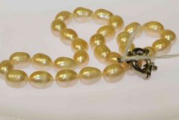 Peach rice shaped freshwater pearl necklace with large clasp,