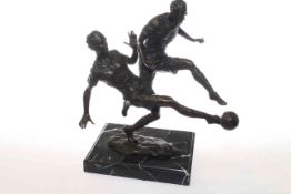 Bronze study of footballers, on a marble base,