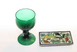 Small tile and green glass goblet