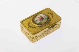 Continental gilt-metal singing bird box, the hinged enamel cover decorated with a piper,