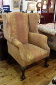 Georgian style wing armchair on carved cabriole ball and claw legs