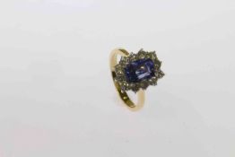 18 carat gold, cushion sapphire and round brilliant diamond cluster ring,
