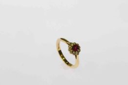 18 carat yellow gold, fine oval ruby and round brilliant diamond cluster ring,