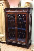 Early 20th Century mahogany china cabinet having a long drawer above two glazed panel doors