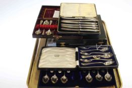 Set of six silver handled knives, three sets of six silver spoons,