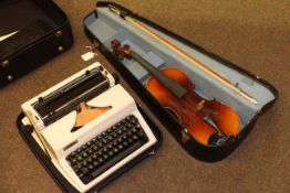 Cased violin and bow,
