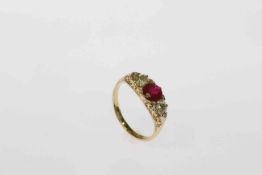 Ruby and diamond ring, the central ruby set between two old brilliant cut diamonds,
