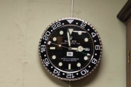 Circular kitchen wall clock marked Rolex