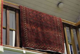 Traditional Persian design rug with a red ground 1.80 by 0.