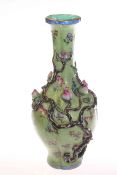 Chinese Famille Rose vase, with moulded blossoming boughs on a sgraffito type ground,