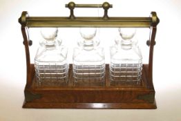Oak and silver plated three bottle tantalus