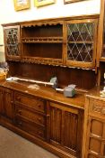 Linen fold oak shelf and glazed cupboard door back dresser