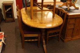 Oval pine extending dining table and four chairs