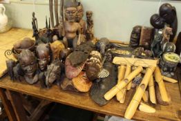 Collection of tribal carvings, busts, masks,